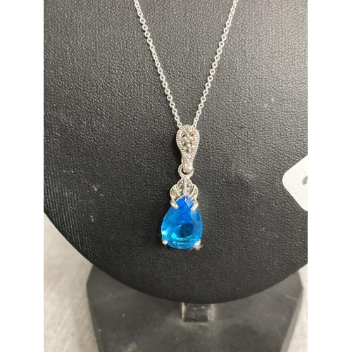 317 - Silver, blue stone set & marcasite pendant on silver chain