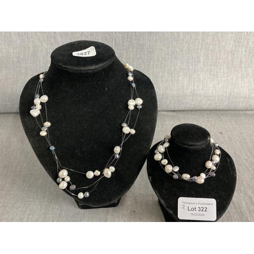 322 - Silver clasped floating pearl necklace with a matching bracelet