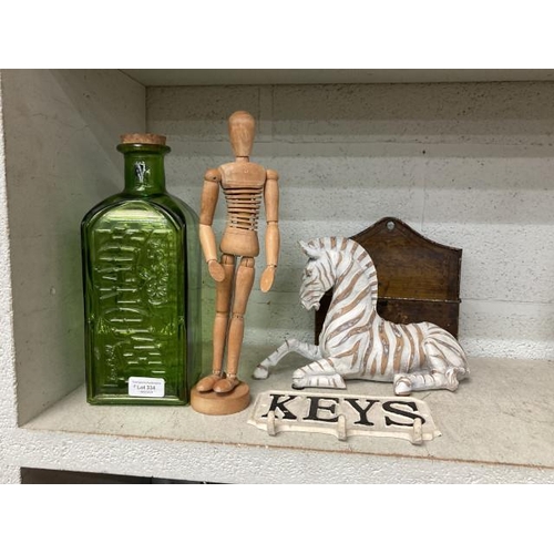 334 - Green glass 'Lemonade' bottle, cast 'Key' hooks, wooden artists mannequin, resin Zebra etc.