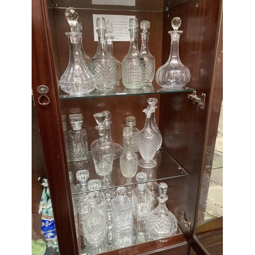 392 - 23 glass decanters inc. pressed glass, lead crystal, cut glass etc.