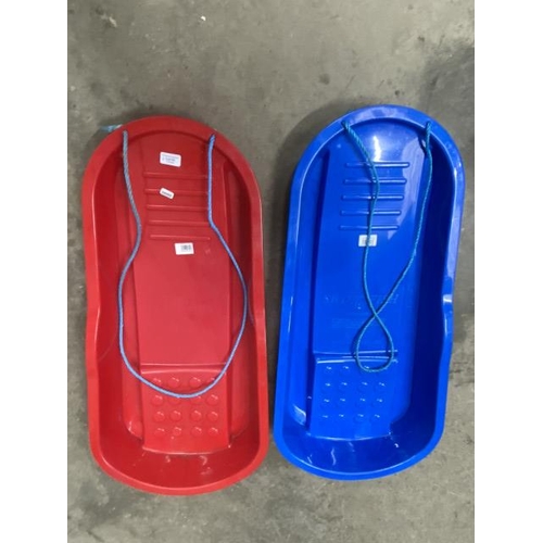 79 - 2 plastic sledges (new)