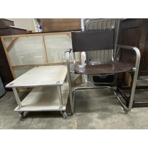 82 - Industrial style coffee table with castors 38H 60W 50D & a leather and chrome office chair 60W