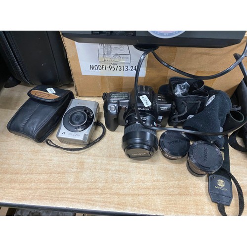 476 - Minolta Dynax 303sl with 2 Sigma convertors for wide XO5 and video camera, Canon IXUS270 with case, ... 