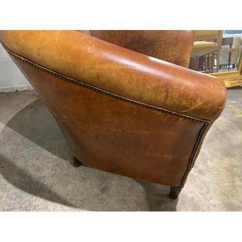 58 - 'Chester's' tan distressed leather tub chair (as found) 77W