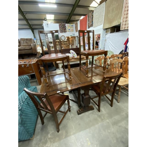 128 - Oak drop leaf table 75H 150W 90D and 4 chairs