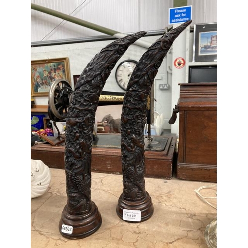 381 - Two resin carved horns/tusks approx. 38H