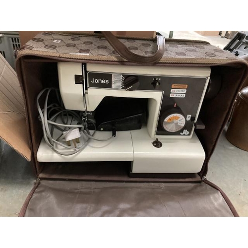 401 - Cased Jones VX520 sewing machine with foot pedal/ mains lead