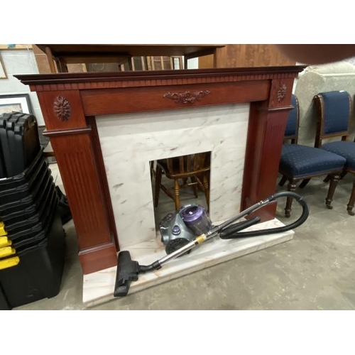 68 - Bush vacuum & a mahogany effect fire surround 111H 143W 38D