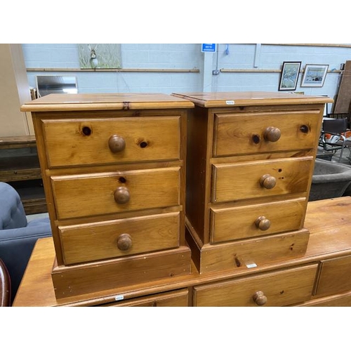 88 - Pair of pine 3 drawer bedside chests 62H 46W 43D