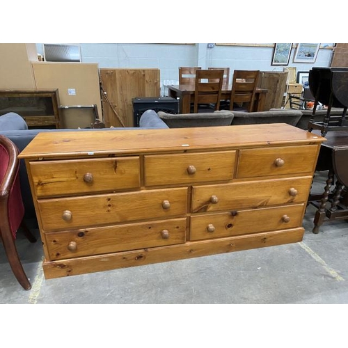 89 - Pine multi drawer chest 78H 172W 43D