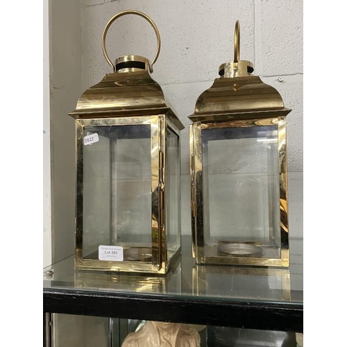 380 - Pair of brass & glass candle lanterns 36cm high