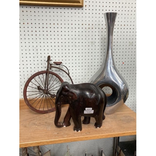 482 - Vintage style metal rimmed model of a Penny Farthing, heavy carved wooden elephant & tall aluminium ... 