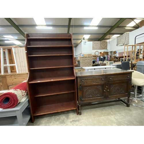 143 - Stained pine waterfall bookcase 175H 91W 31D and a carved oak 2 door sideboard 86H 127W 50D