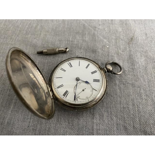 263 - Silver cased pocket watch with key