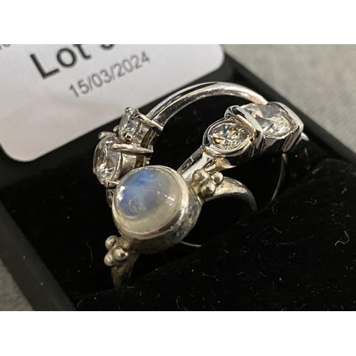 303 - 3 silver tone rings inc. moonstone (sizes O & 2 V's)