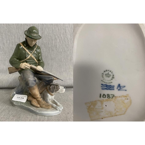 319 - Royal Copenhagen porcelain figure 'Hunter With Dog' 1087 (Chip/ repair to rim of hat, 21.5cm high)