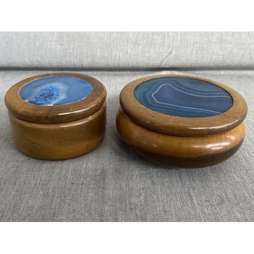 322 - Two polished agate lidded wooden trinket boxes