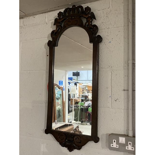 114 - Carved oak wall mirror with cherub detail 36 x 90cm