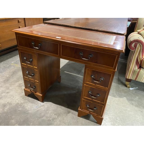 119 - Yew wood pedestal desk with brown leather inset 76H 91W 46D