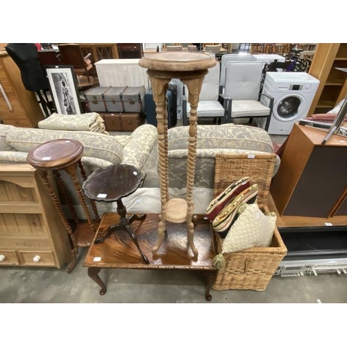 194 - 2 barley twist torcheres 99H & 103H, mahogany coffee table 42H 79W 40D, wicker laundry basket, scatt... 