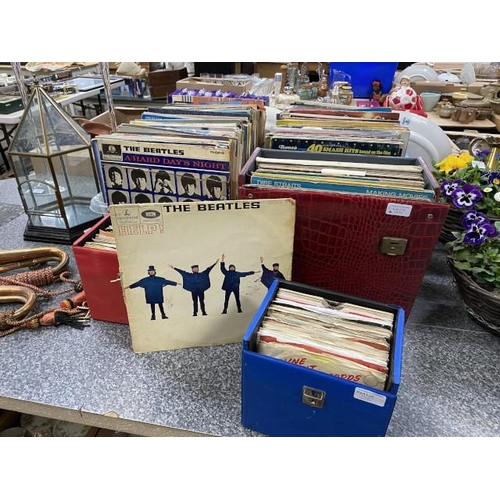 215 - 2 boxes & 3 cases of LP's & singles inc. The Beatles, Paul Simon, Olivia Newton-John etc.