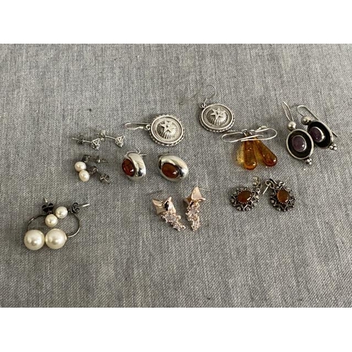 298 - 9 pairs of silver earrings