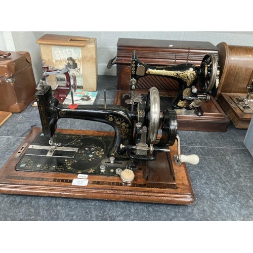 411 - Oak cased Singer P857439 sewing machine & ASMC 1863 E. Todd & Co. London sewing machine (latter no c... 