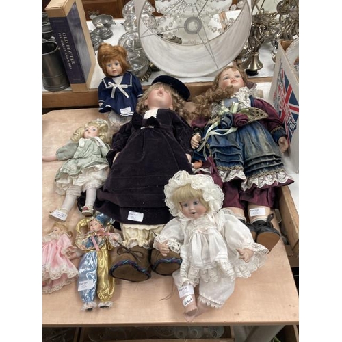 526 - 7 assorted porcelain dolls