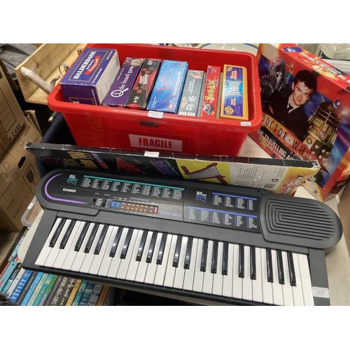 551 - Casio CTK-80 keyboard (battery operated) games including Dr Who, Yahtzee, Balderdash, 2 boxes of boo... 