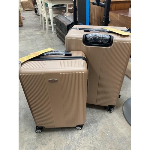 571 - 2 graduated AHOY suitcases in champagne (24” & 28”) NEW