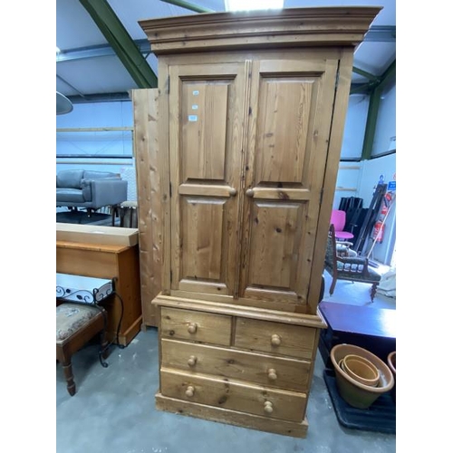 102 - Pine 2 door/4 drawer wardrobe with hanging rail to the interior 204H 95W 56D