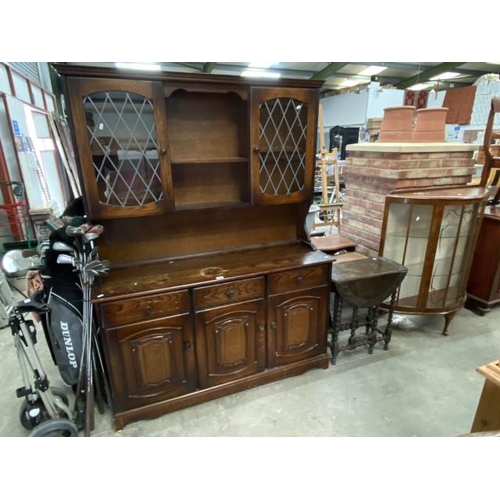 106 - Oak dresser 182H 138W 44D, oak barley twist drop leaf table 67H 63W 28-76W & a vintage display cabin... 