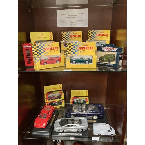 395 - 2 shelves of model cars inc. Burago, Corgi, Days Gone, Maisto etc.