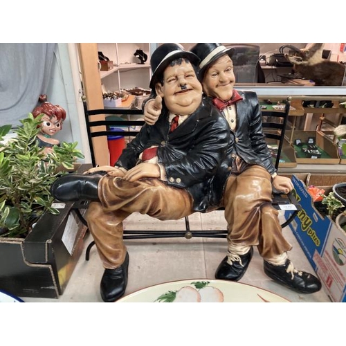 416 - Resin Laurel & Hardy figurine seated on a bench 60W 55H