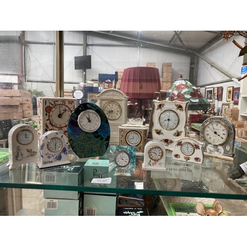 422 - 11 decorative mantel clocks inc. Belleek, Wade, Wedgwood, Royal Albert, Caithness, Aynsley etc.