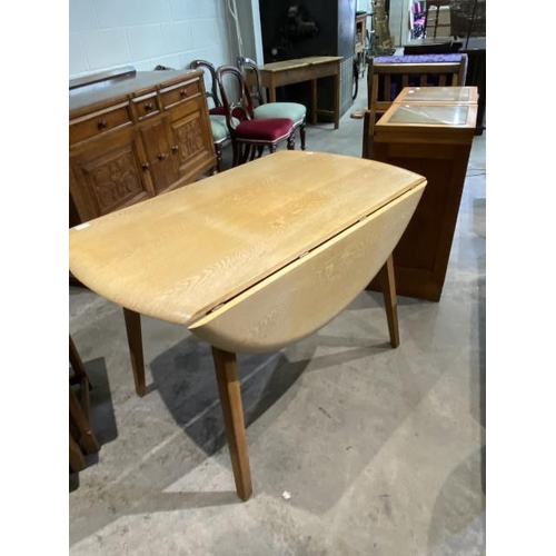 67 - Mid century oak drop leaf table 73H 110W 64-128D (please note sun damage to the table)