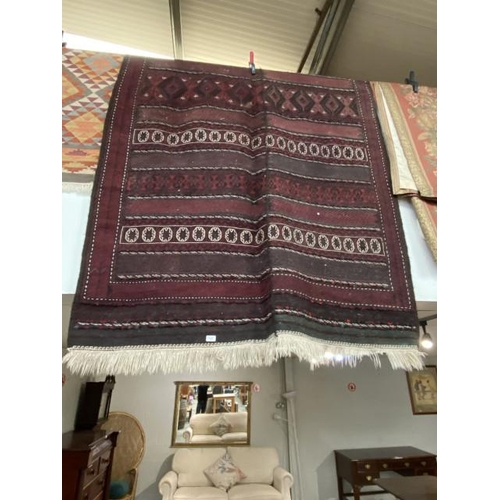 91 - Hand knotted burgundy ground carpet 310 x 160cm