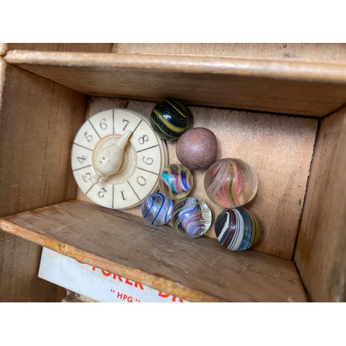 446 - Victorian pine games box containing amber blizzard marbles, solitaire board, cribbage, dominoes etc.... 