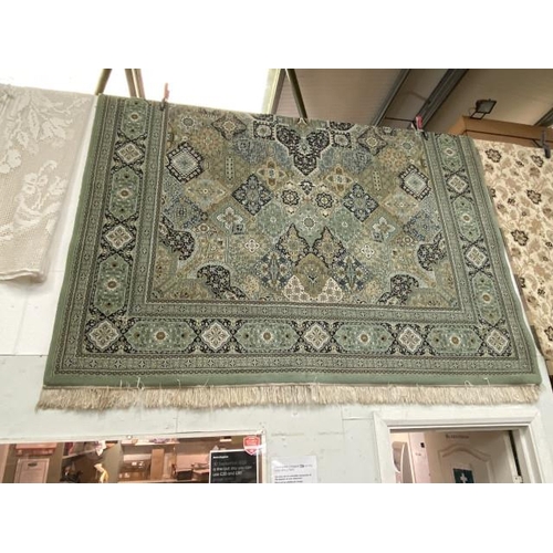 168 - Good quality green and beige woollen floor rug 360 x 250cm