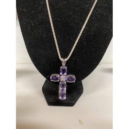 264 - Crucifix pendant on a silver chain (chain length 60cm)