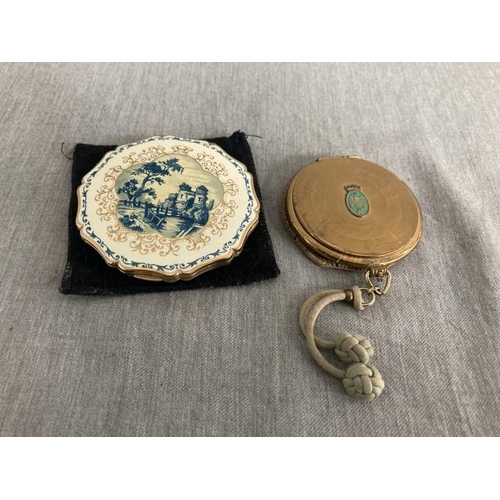 318 - Coty watch style powder compact & a Stratton with folly design compact (both with slip cases)