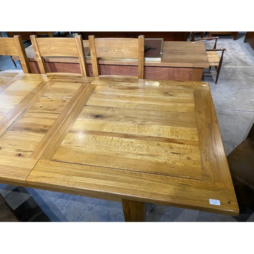 92 - Barker & Stonehouse extending oak dining table 79H 250W 100D with 6 matching chairs and 2 brown sued... 