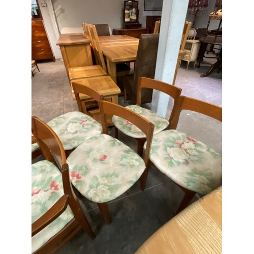 104 - Mid century 'Nathan' teak extending dining table 76H 122cm diameter and 6 chairs including 2 carvers