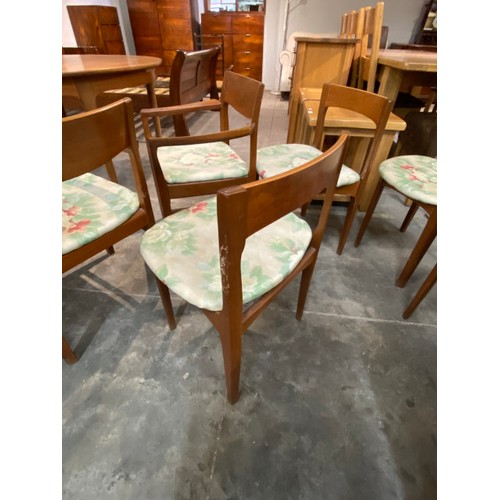 104 - Mid century 'Nathan' teak extending dining table 76H 122cm diameter and 6 chairs including 2 carvers