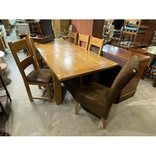 100 - Barker & Stonehouse extending oak dining table 79H 250W 100D with 6 matching chairs and 2 brown sued... 