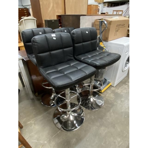 145 - 4 black faux leather and chrome rise and fall bar stools