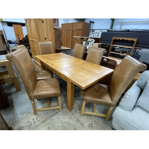 231 - Good quality oak dining table 77H 182W 90D and 6 tan leather high back dining chairs