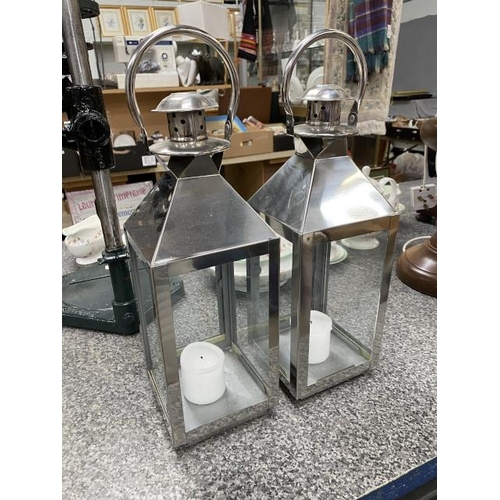 280 - Pair of polished stainless steel candle lanterns 40H