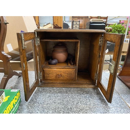 290 - Edwardian oak smokers cabinet containing terracotta tobacco jar, 2 pipes with key 32W 29H 19D