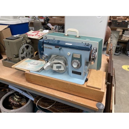 558 - Cased New Home 574 sewing machine with foot pedal, power lead and manual.